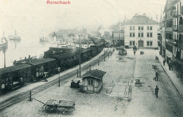 Seltenes Schokoladen-Sammelbild: Hafenplatz mit Dampfzug und Bahnhof